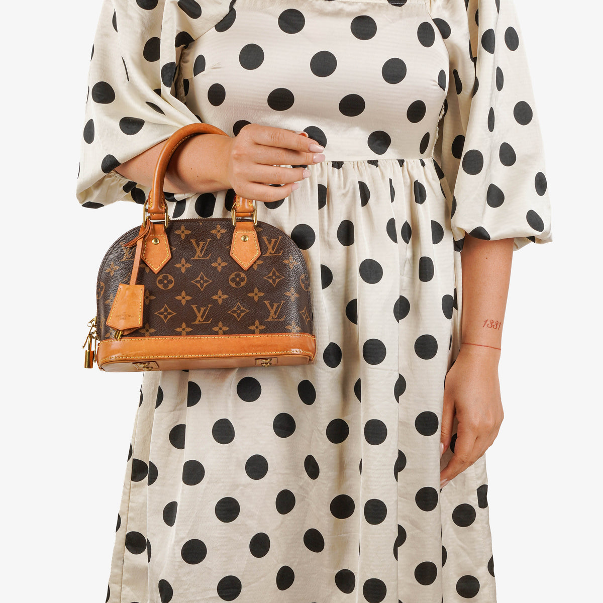 Louis Vuitton Alma BB Monogram Canvas Handbag