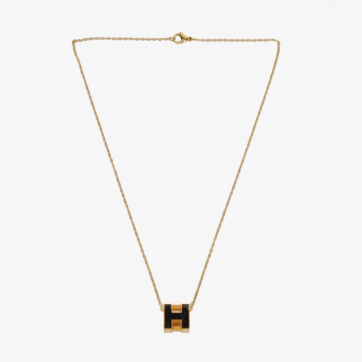 Hermès Gold Plated and Black Enamel Cage D'H Pendant Necklace