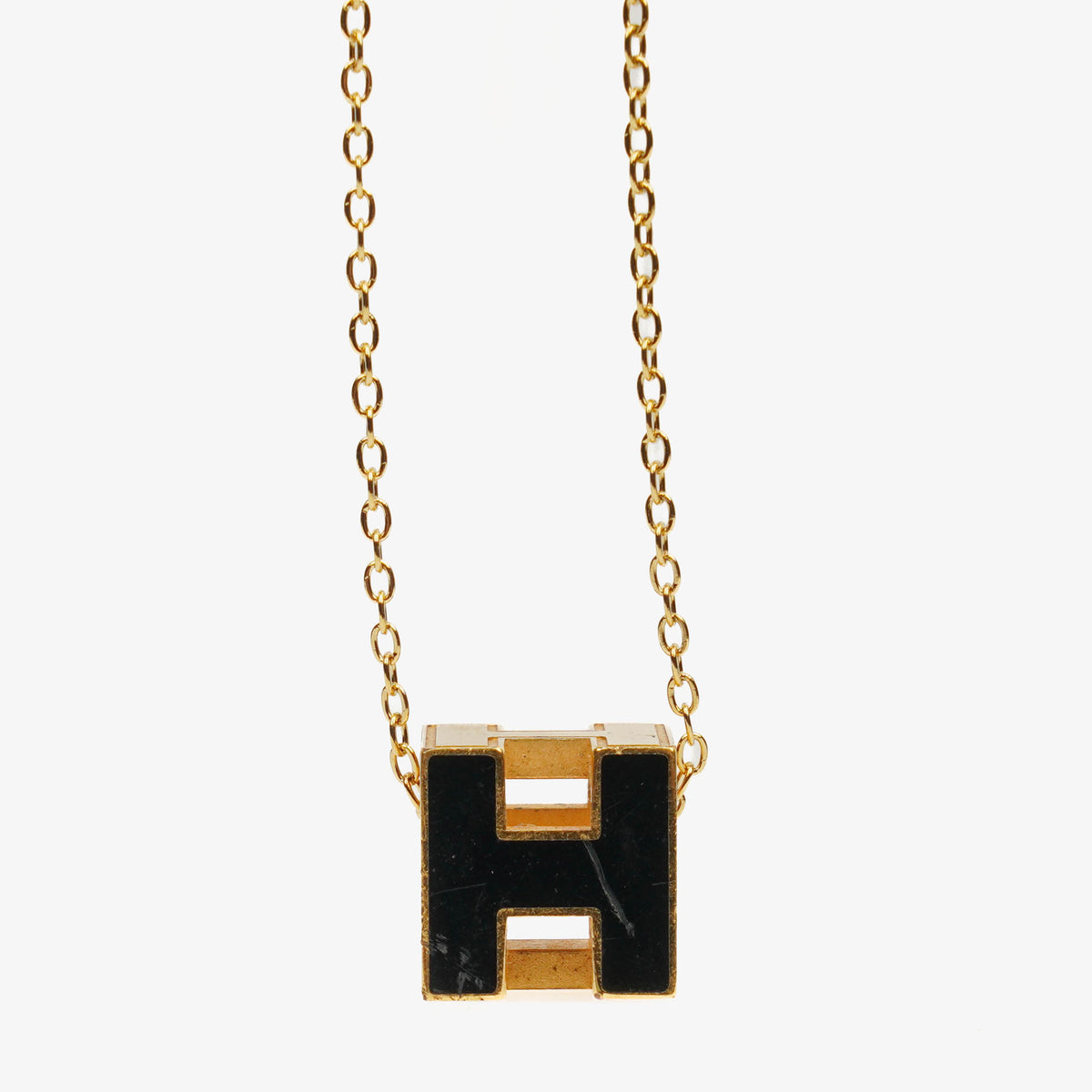 Hermès Gold Plated and Black Enamel Cage D'H Pendant Necklace