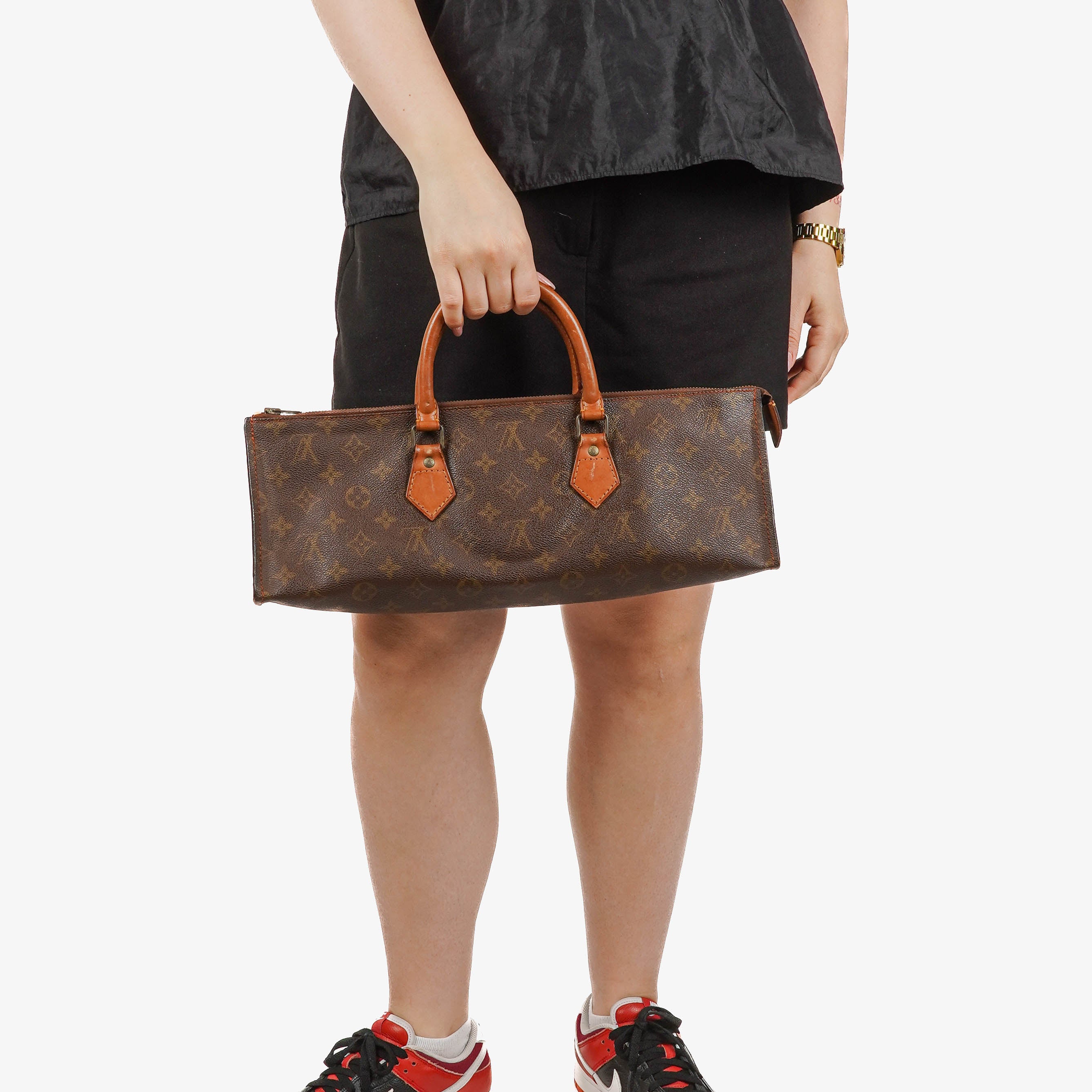 Louis Vuitton Sac Triangle Monogram Handbag