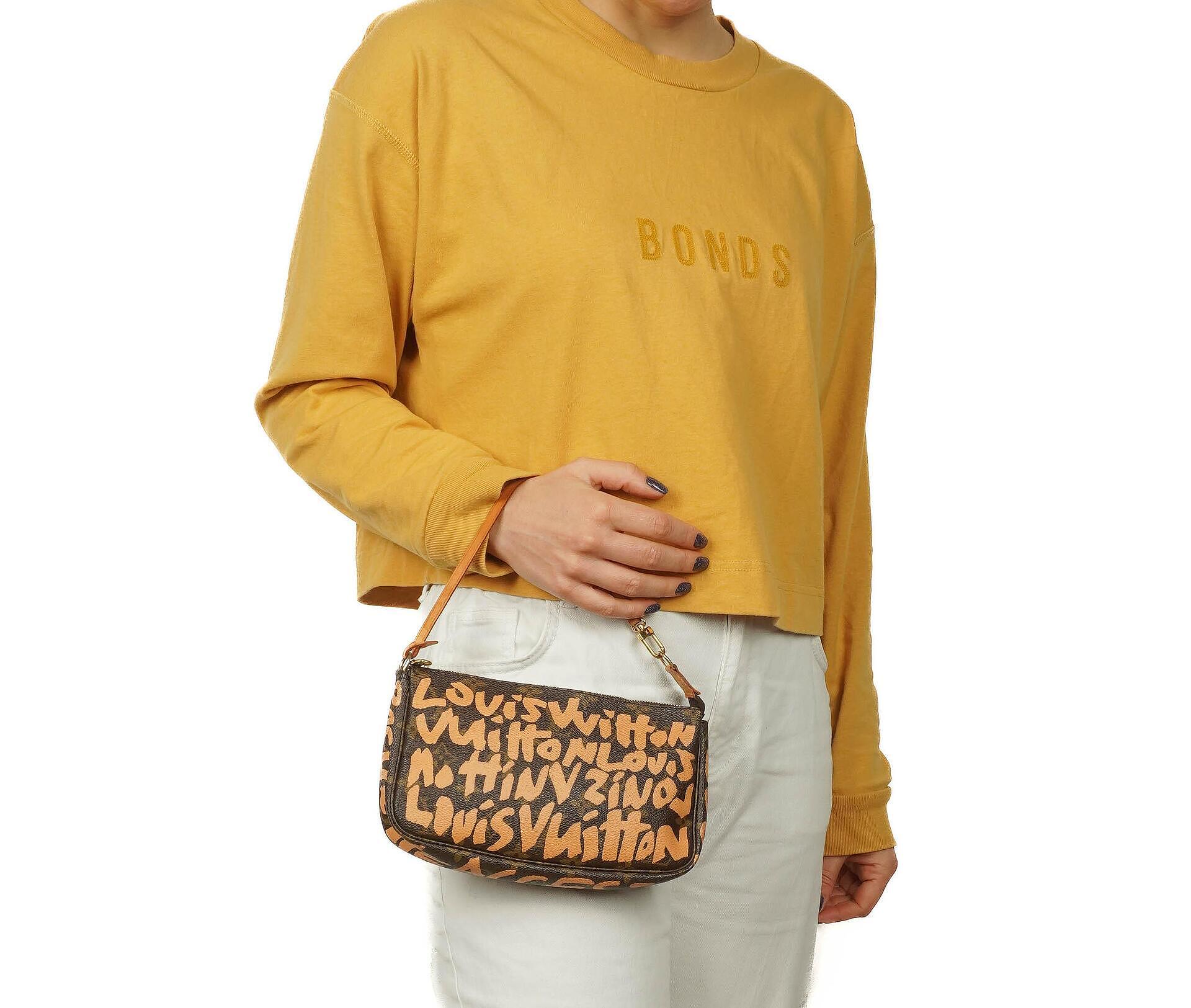 Louis Vuitton Pochette Accessoire in Monogram Graffiti Canvas Clutch Handbag a part of Stephen Sprouse collection