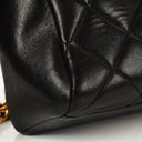 Sac appareil photo vintage Chanel en cuir matelassé noir avec ferrures plaquées or 24 carats