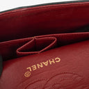 Chanel Double Flap Bag in Quilted Black Lambskin With 24K Gold-Plated Hardware