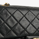 Chanel Double Flap Bag in Quilted Black Lambskin With 24K Gold-Plated Hardware