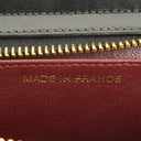 Pochette bracelet Chanel en cuir verni noir avec logo CC