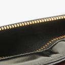 Pochette bracelet Chanel en cuir verni noir avec logo CC