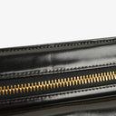 Pochette bracelet Chanel en cuir verni noir avec logo CC
