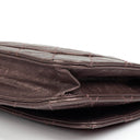 Portefeuille sur chaîne (WOC) 2.55 Reissue en cuir de veau métallisé vieilli matelassé violet Chanel