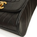 Chanel Maxi Logo Crossbody Flap Bag Black Vertical Quilted Lambskin 24K Gold-Plated Hardware
