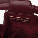 Petit sac seau en cuir bordeaux Must De Cartier