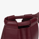 Petit sac seau en cuir bordeaux Must De Cartier