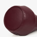Petit sac seau en cuir bordeaux Must De Cartier