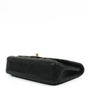 Chanel Classic Medium Double Flap Bag In Black Quilted Caviar Leather With 24K Gold-Plated Hardware