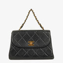 Chanel Flap Bag In Black Quilted Lambskin With Chain Top Handle And 24K Gold-Plated Hardware