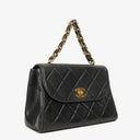Chanel Flap Bag In Black Quilted Lambskin With Chain Top Handle And 24K Gold-Plated Hardware
