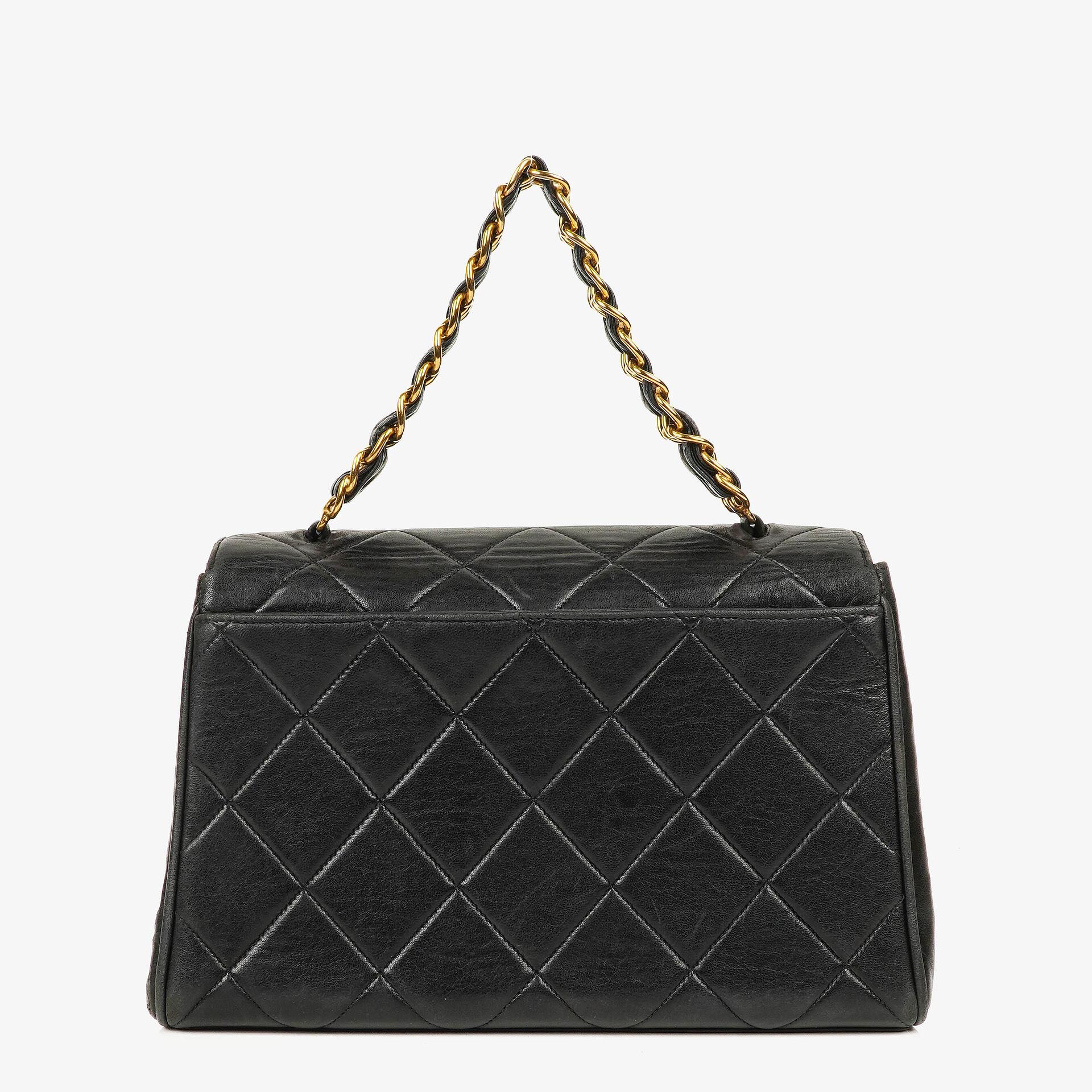 Chanel Flap Bag In Black Quilted Lambskin With Chain Top Handle And 24K Gold-Plated Hardware