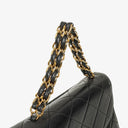 Chanel Flap Bag In Black Quilted Lambskin With Chain Top Handle And 24K Gold-Plated Hardware