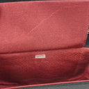 Sac à rabat demi-lune Chanel en jersey matelassé noir avec ferrures plaquées or 24K