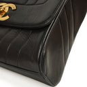 Chanel Maxi Logo Crossbody Flap Bag Black Vertical Quilted Lambskin 24K Gold-Plated Hardware