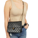Chanel Timeless Classic Small Flap Bag In Black Quilted Lambskin And 24K Gold-Plated Hardware