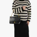 Chanel Vintage Medium Timeless Classic Double Flap Bag In Black Quilted Lambskin With 24K Gold-Plated Hardware And Mademoiselle Chain